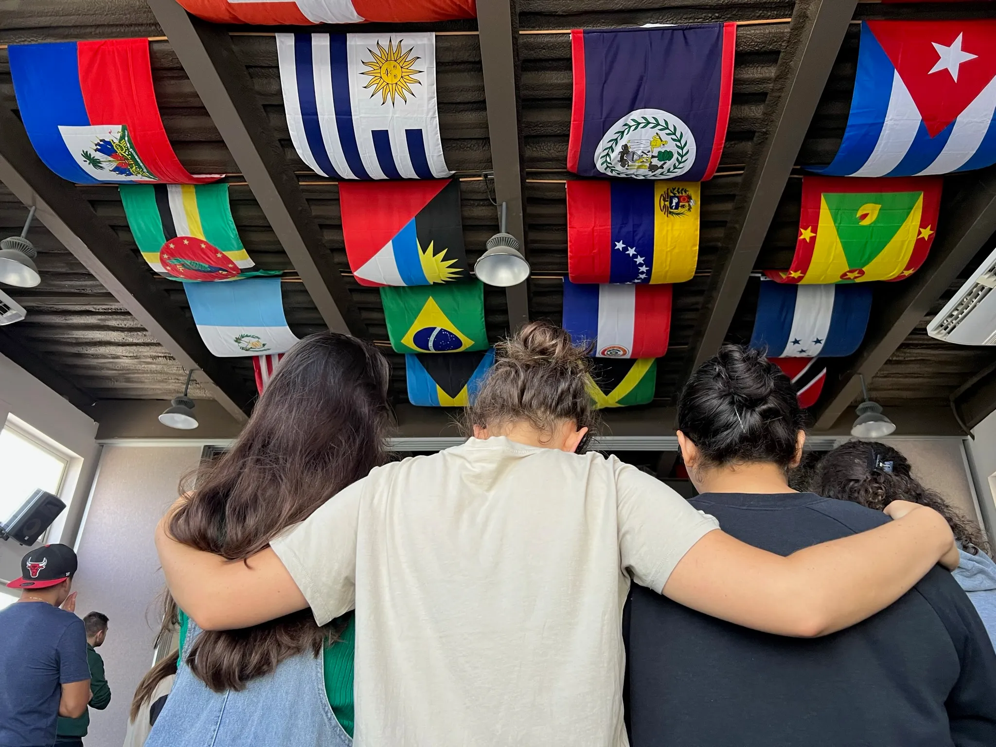 YWAM students standing together with national flags